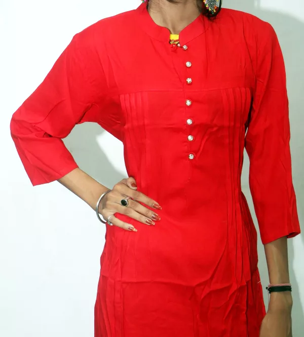 Torso of a woman in a red rayon kurti with pintucks and a button placket