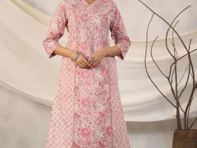 Woman in a pink floral block-printed A-line kurta with matching pants