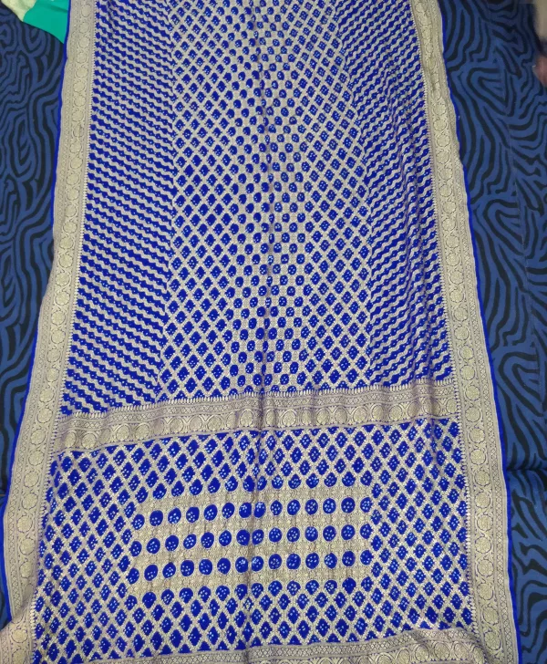 Royal blue bandhani dupatta with a gold zari grid pattern, laid flat
